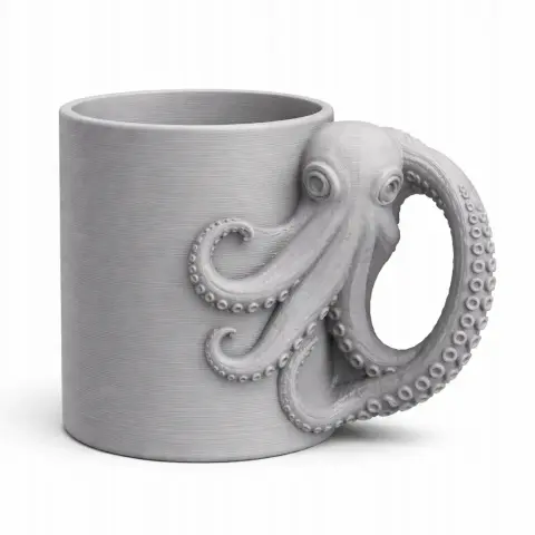 Gray mug with octopus tentacle forming the handle, featuring suction cup details.