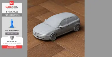 A detailed 3D printed model of an Alfa Romeo 147 car on a wooden surface.