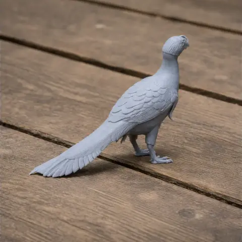 Gray 3D printed model of a Microvenator dinosaur, resembling a bird, on a wooden surface.