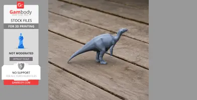 A gray 3D-printed model of a Muttaburrasaurus on a wooden surface.