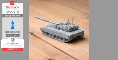 3D-printed Al-Khalid tank model on wooden surface, showcasing detailed design and tracks.