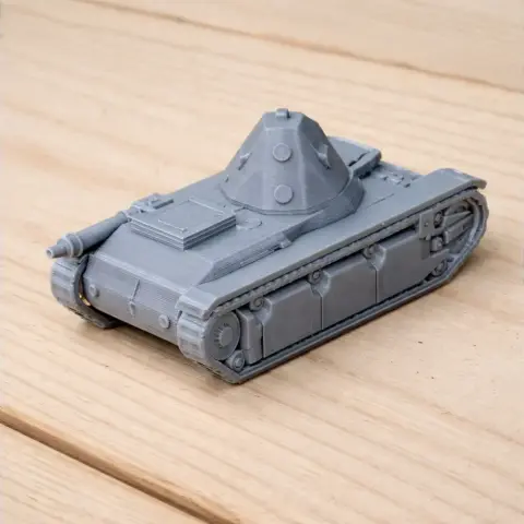 Gray 3D-printed model of an AMX 38 tank on a wooden surface.