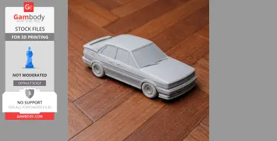 3D printed model of a classic Alfa Romeo 75 car on a wooden floor.