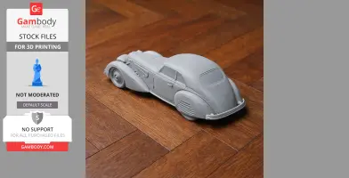 3D printed model of an Alfa Romeo 8C 2900 on a wooden floor, showcasing vintage car details.