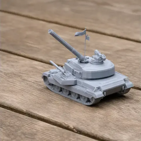 Gray 3D-printed model of a tank with two flags, displayed on a wooden surface.