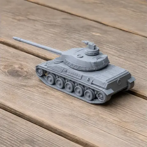 Gray 3D-printed model of an AMX-32 tank with detailed tracks and turret, resting on a wooden surface.