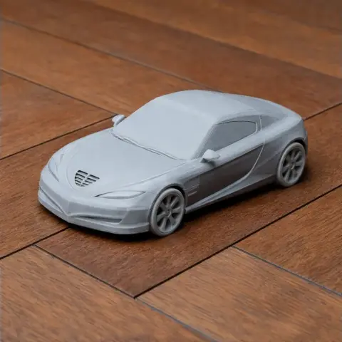 3D-printed model of a sleek sports car on a wooden surface, showcasing detailed design and smooth finish.