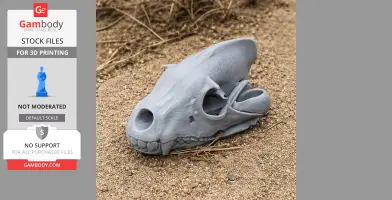 A detailed 3D-printed brown hyena skull replica on sandy ground.