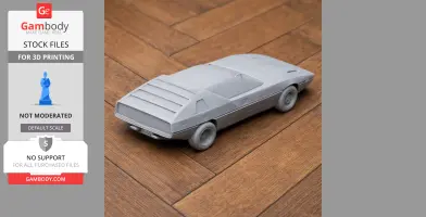3D-printed model of a futuristic, angular car resembling an Alfa Romeo Caimano, on a wooden surface.