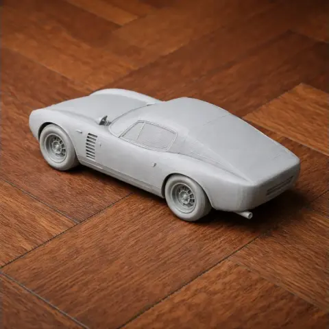 3D-printed Alfa Romeo Canguro model on a wooden surface, showcasing sleek and classic car design.
