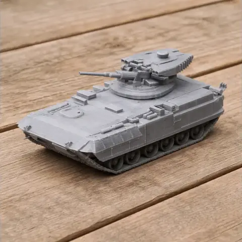 A detailed 3D-printed model of a combat tank with a rotating turret and cannon, displayed on a wooden surface.