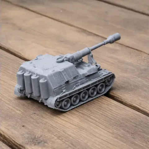 A detailed gray 3D-printed model of an AS-90 tank on a wooden surface.