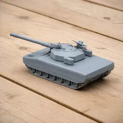Gray 3D-printed ASCOD tank model with a detailed turret and cannon, placed on a wooden surface.