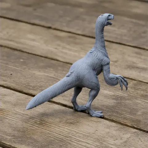 Gray 3D-printed model of a Neimongosaurus, standing with a long tail and raised claws.
