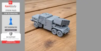 A detailed 3D-printed model of a military tank-like vehicle with a turret and multiple wheels on a wooden surface.
