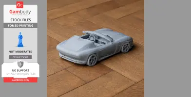 Gray 3D-printed model of an Alfa Romeo Disco Volante car on a wooden surface.