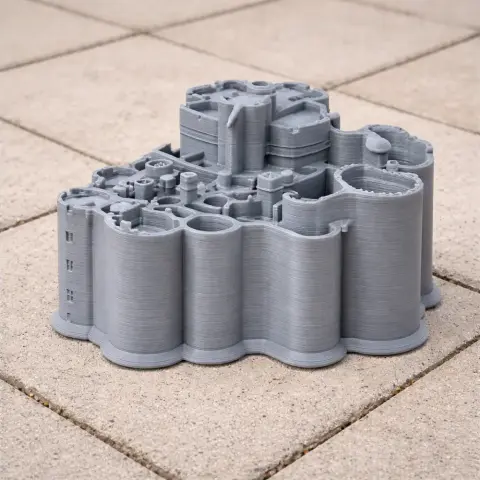 A detailed 3D-printed model of Alnwick Castle, featuring cylindrical towers and intricate architecture.