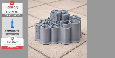 3D printed gray model of Alnwick Castle on tiled surface, showing detailed towers and walls.