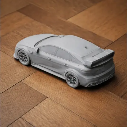 3D-printed scale model of an Alfa Romeo Giulietta car on a wooden surface.