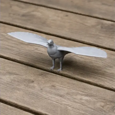 3D printed model of a prehistoric vulture with wings spread, on a wooden surface.