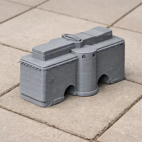 3D-printed model of Arg of Tabriz, featuring fortified walls and towers, on a tiled surface.