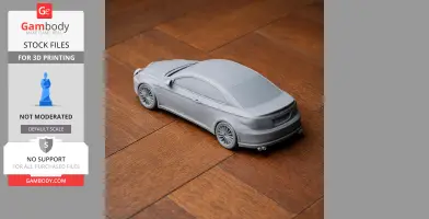 Gray 3D-printed Alfa Romeo GT model car on a wooden surface.