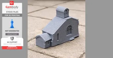 A gray 3D printed model of a small church with textured walls and a detailed roof.