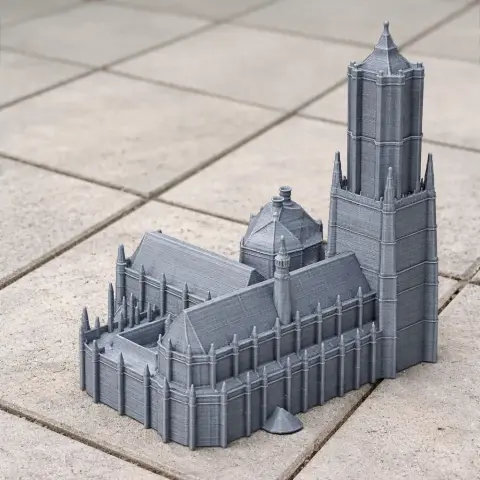 Detailed 3D-printed model of a Gothic-style cathedral with a tall tower.
