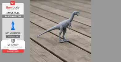 Gray 3D-printed Notatesseraeraptor model on wooden surface, showcasing prehistoric design.