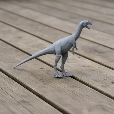 3D-printed model of a dinosaur standing on a wooden surface.