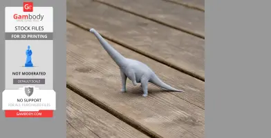 Gray 3D-printed Notocolossus dinosaur model on a wooden surface.