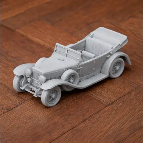 3D-printed scale model of an Alfa Romeo RL car on a wooden surface.