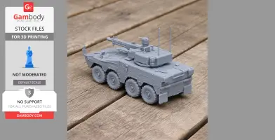 Gray 3D-printed Boxer Infantry Fighting Vehicle model with detailed turret and wheels on wooden surface.