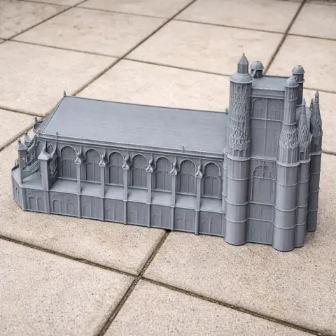3D printed model of Auxerre Cathedral with detailed arches and towers on a tiled surface.