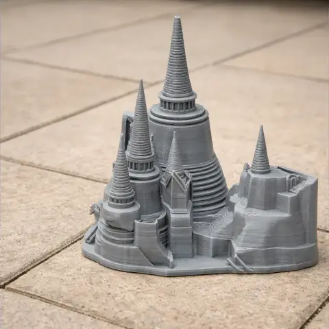 3D-printed model of Ayutthaya Kingdom architecture with multiple spires on a tiled surface.