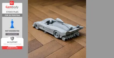 3D-printed scale model of the Alpine A441 race car on a wooden floor.
