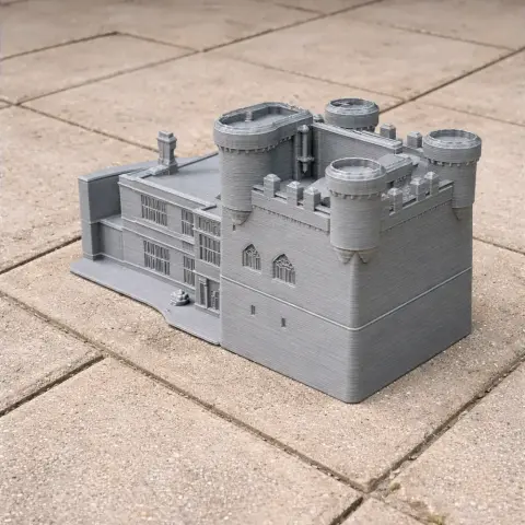 3D printed model of a medieval-style castle with towers and detailed architecture.