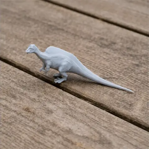 A 3D-printed model of an Ouranosaurus dinosaur on a wooden surface.