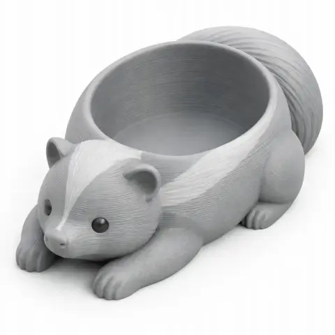 3D printed skunk-shaped bowl with detailed fur design and a curled tail as the bowl handle.