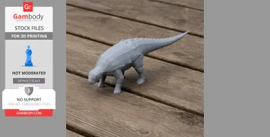 3D-printed gray Panoplosaurus model on wooden surface.