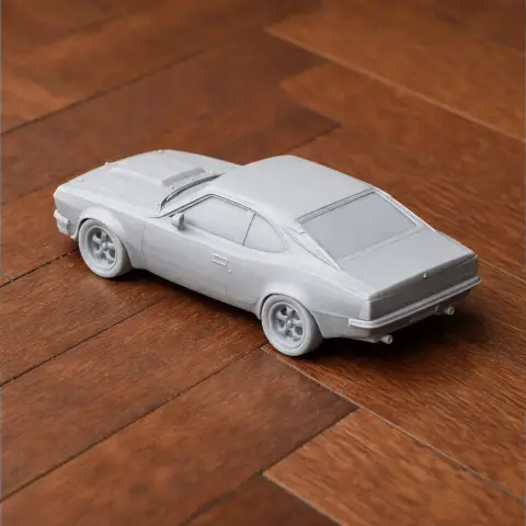 3D printed AMC Hornet scale model on a wooden surface.