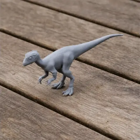 Gray 3D-printed Parksosaurus model on a wooden surface.