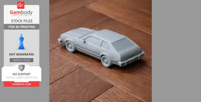 3D-printed model of an AMC Spirit vehicle on a wooden surface.
