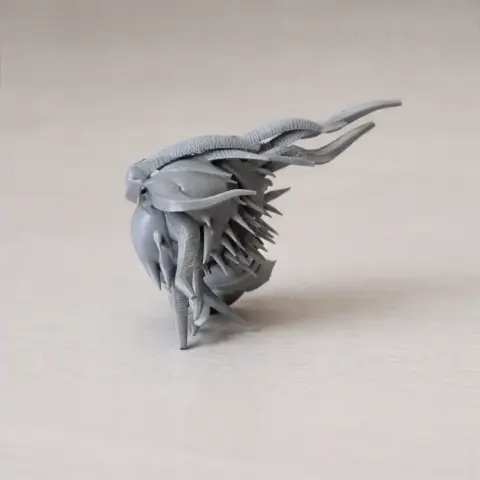 A detailed, spiky creature's head with elongated tendrils, designed for 3D printing.