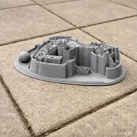 A gray 3D-printed model of Berkeley Castle on a tiled surface.