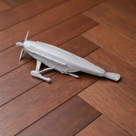 3D printed model of Antonov An-2 airplane on a wooden surface.