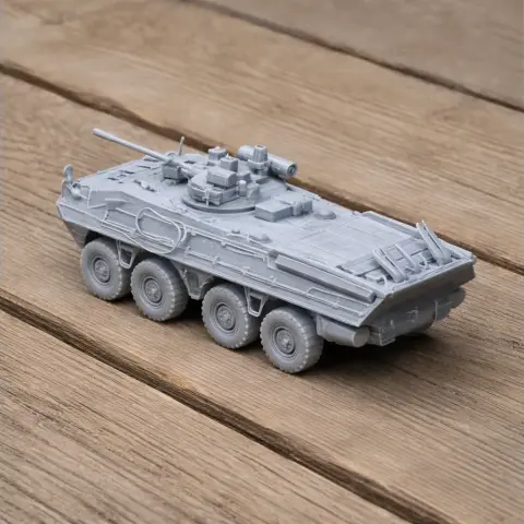 Detailed 3D-printed model of a BTR-90 tank with turret and eight wheels on a wooden surface.