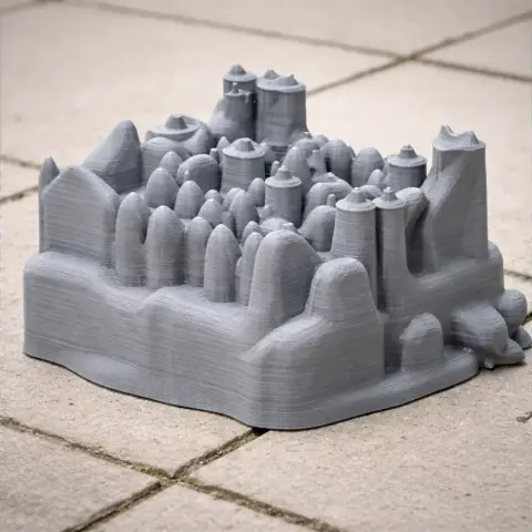 3D printed model of Beverstone Castle, featuring towers and detailed architecture on a tiled surface.