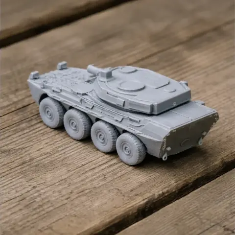 Gray 3D-printed Centauro tank destroyer model on a wooden surface.