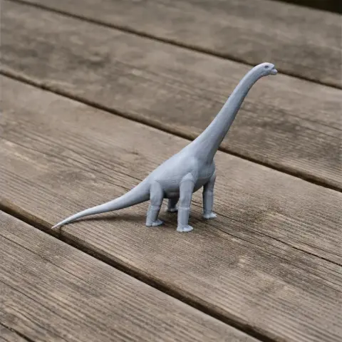 3D printed model of a long-necked prehistoric dinosaur on a wooden surface.